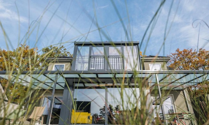 Krakow am See Apartment | Elegant Waterfront Retreat with Private Boat Access