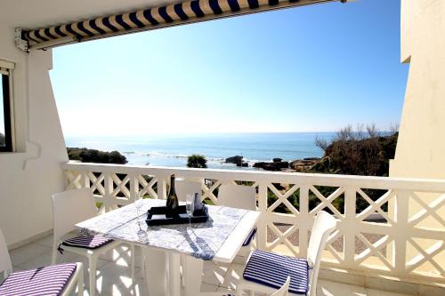 Areias de Sao Joao Apartment | Stunning Beachfront Apartment with Pool and Ocean Views