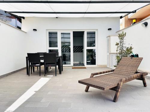 Fregenae Apartment | Inviting Maison Blue with Patio - Family-Friendly Escape