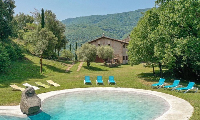 Sant Feliu de Pallerols Apartment | Relaxing Retreat at Rural Apartment Cal Sidro, Aiguabella