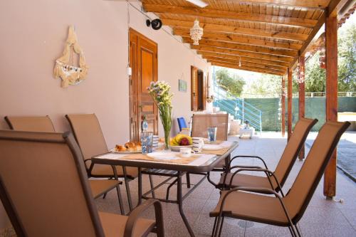 Pineios House | Relax at Malou Garden House Steps from the Beach