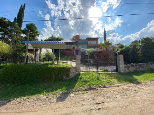 Villa Carlos Paz House | Malvina Hotel: Oceanfront Retreat with Pool & Pet-Friendly