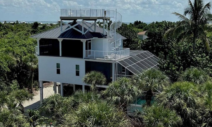 North Captiva House | Manatee Haven: Oceanfront Pool, Spa, and Golf Carts Await!