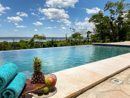 Itaugua House | Picturesque Mansion a Lago with Oceanfront Pool Access