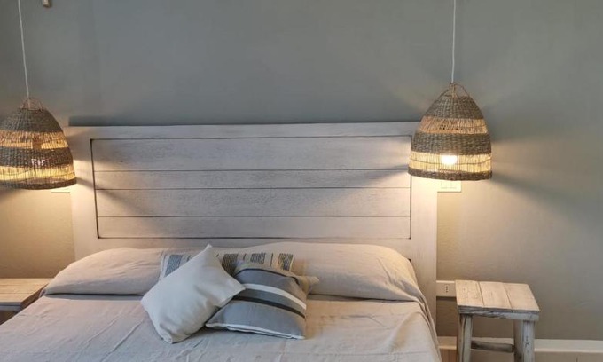 Baia Sant'Anna Apartment | Pet-Friendly Retreat: Discover Margherita's Family Comfort