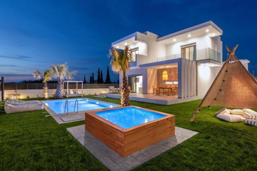 Petaloudes Villa | Relax at Martinis Villas: 4-Star Oceanfront Retreat