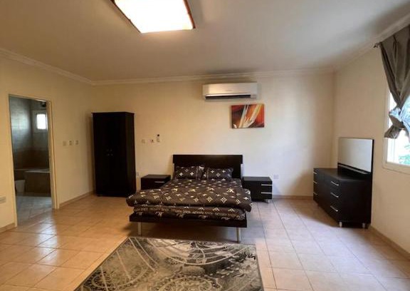 Doha Apartment | Elegant Master Bedroom with Pool & Entertainment Facilities
