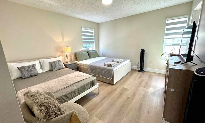 Surrey House | Master bedroom with private bathroom in British Columbia, Canada