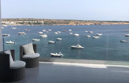 Għadira Apartment | Exceptional Mellieha Bay Waters Edge with Oceanfront Views