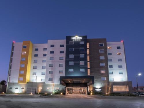 Irapuato Hotel | Modern Microtel Inn & Suites: Oceanfront with Pool Access