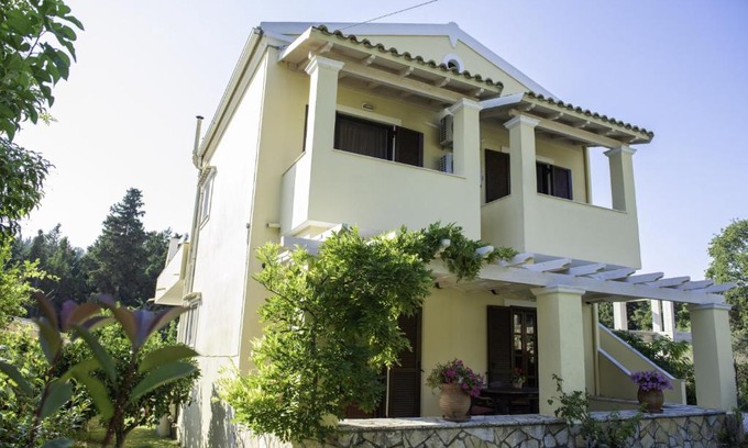 Agios Georgios Pagon Apartment | Seaside Comfort at Miltiadis Apartments - Rated 9/10