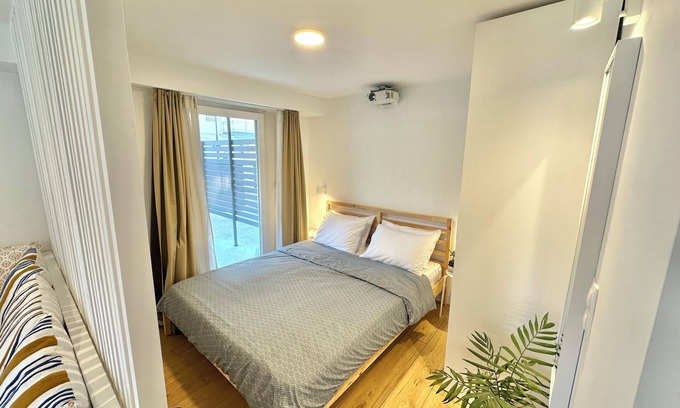 Olymbiaki Akti Apartment | Seaside Getaway: The Evergreen Apartment with Private Patio