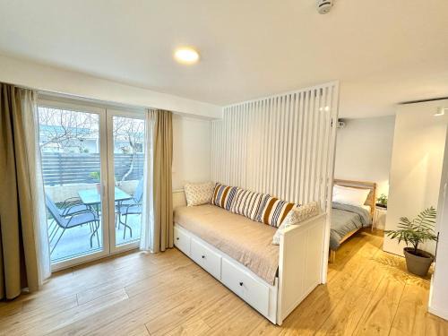 Olymbiaki Akti House | Seaside Apartment with Private Patio and Ocean View