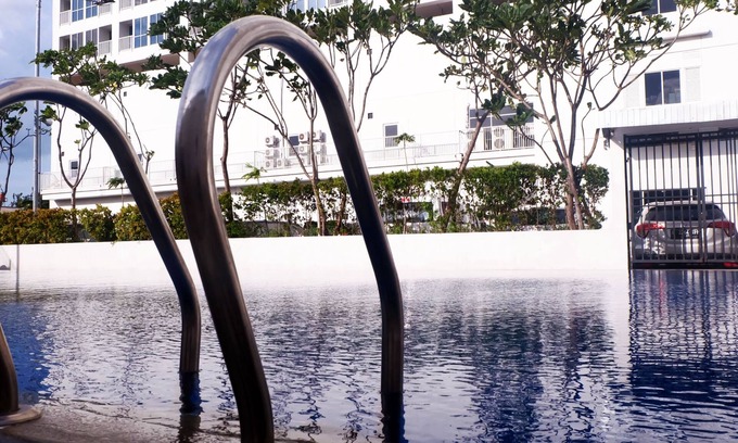 Kayu Putih Apartment | Modern Studio with City Views and Pool at Tifolia Apartment
