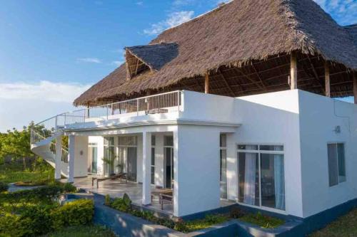 Fumba Villa | Experience Mkoko Villa: Oceanfront Bliss for All