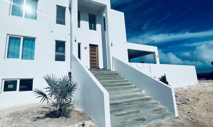 Long Bay Villa | Stunning Villa Steps from Beach with Pool & Ocean Views