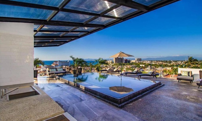 Colonia 5 de Diciembre Apartment | Prime City Living Steps from Attractions and Ocean Views