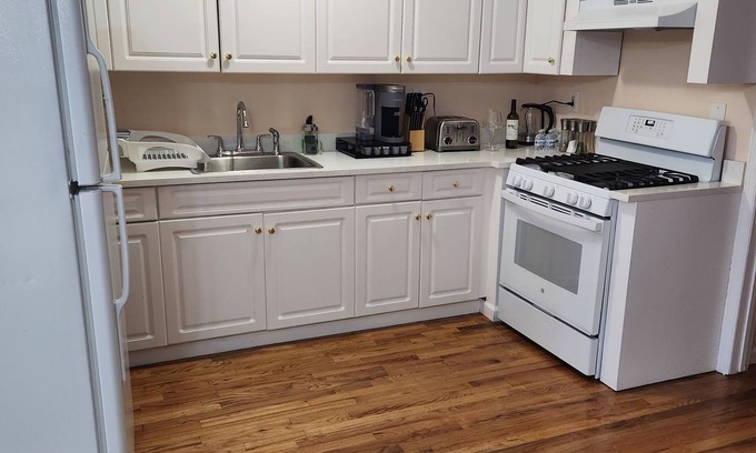 East New York House | Modern 4-Bed Grey Retreat with Free Wine & Pet-Friendly Perks