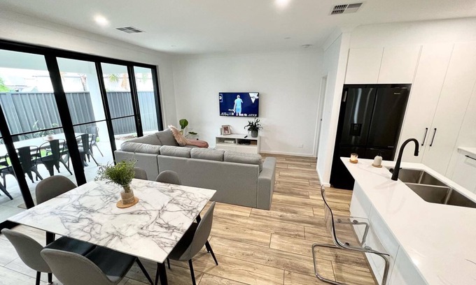 Warradale House | Convenient Getaway Near Train Station, Cafes, and Beach
