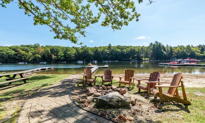 Oakland House | Lakefront Escape: Private Dock, Fire Pit & Spa Amenities