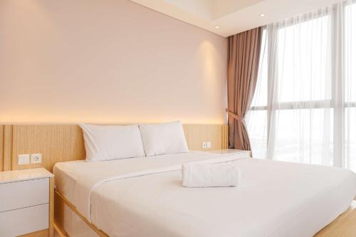Pantai Indah Kapuk Apartment | Stylish 2BR Gold Coast Apartment with Pool & Family Fun