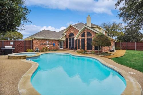 Rowlett House | Modern Retreat with Pool, Backyard Oasis & Cinema Experience