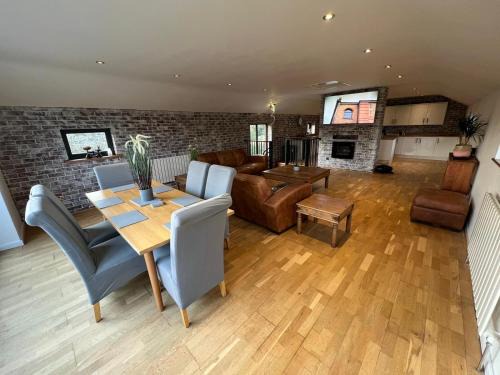 Roughton House | Trendy Upside Down Retreat with Hot Tub & Family-Friendly Perks