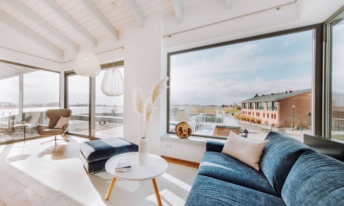 Waase Apartment | Modern Bodden Apartment with Sauna, Fireplace & Pool