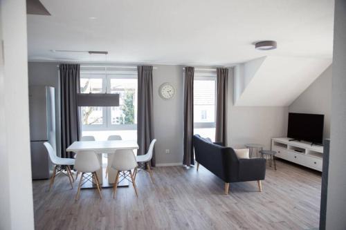 Trossingen Apartment | Modern Retreat with Fireplace and Rooftop Terrace