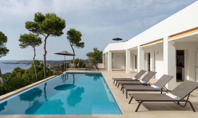 Sant Josep de sa Talaia Villa | Relax at Molí: Oceanfront Haven with Pool and Fireplace