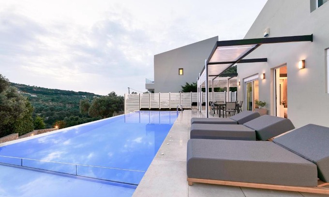 Agia Triada Villa | Exceptional Moly Villa with Heated Pool & Ocean Views