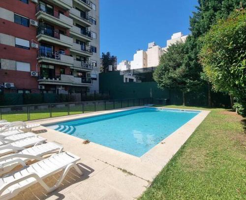 Belgrano Apartment | Monroe Suites: Poolside Retreat with Garage Access