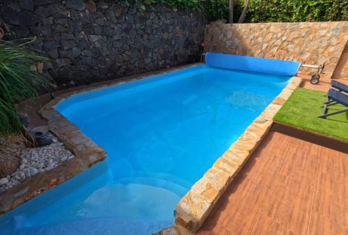 Yaiza Apartment | MoonLava: Poolside Retreat with Oceanfront Views