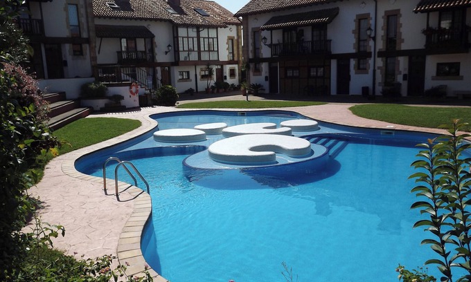 Somo Ski Chalet | Inviting Mountain House with Pool & Garden Near Somo Beach