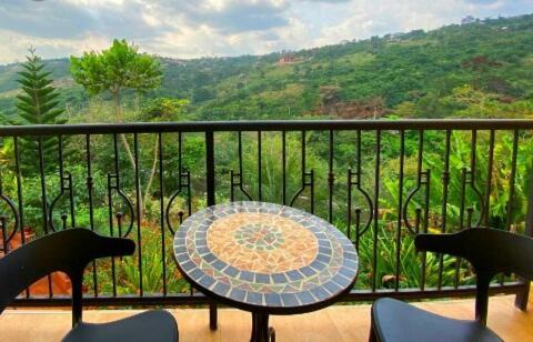Fort Portal Hotel | Cozy Mountain's Lounge: Pet-Friendly Stay with Pool & Hot Tub