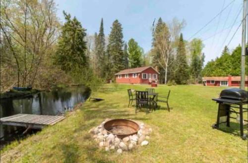 Cheboygan House | Unwind at Mud Creek Cottage: Pet-Friendly Retreat Awaits