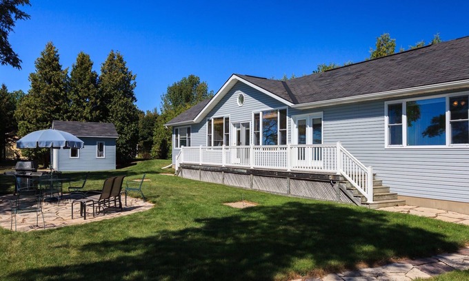 Zurich Cottage | Discover Mystic Bay Lakefront Beach House with Pool & Spa