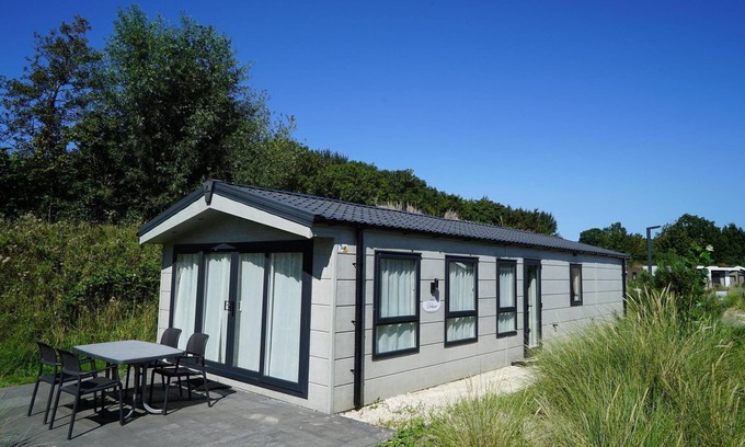 Municipality of Hellevoetsluis House | Cozy Chalet with 3 Bedrooms and Terrace, Pet-Friendly
