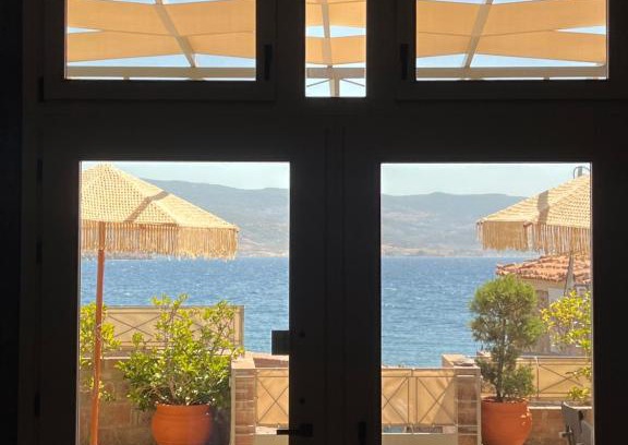 Mithimna Villa | Explore Neptune Oasis: Oceanfront Stay with Hot Tub & Breakfast