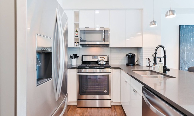 Mission District Condo | Prime Location with Heated Parking & Spa Near Saddledome