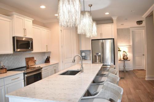 Folly Field House | Beach House with Heated Pool & Elevator, Steps from Ocean