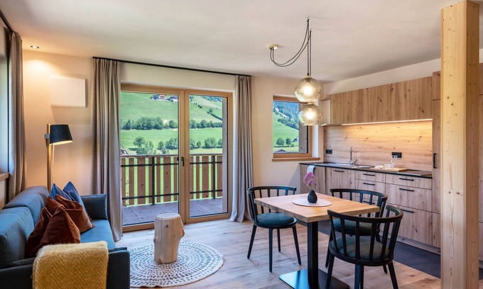 Santa Maddalena Apartment | Modern Apartment Poma: Mountain Views & Relaxing Garden