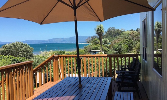 Parapara House | *NEW LISTING* Beachfront bach - your slice of paradise.