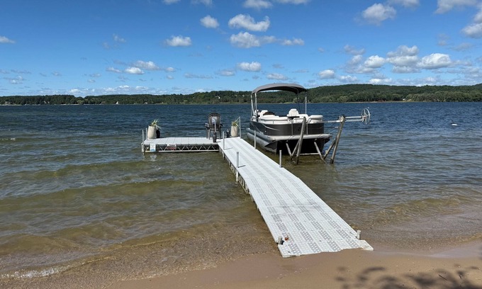 East Jordan House | Lake Charlevoix Retreat with Private Dock & Golf Cart Access