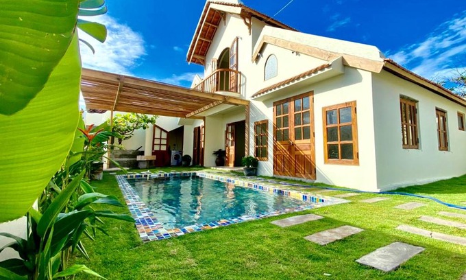 Dong Hoa House | Discover NGÀI Villa: Oceanfront Retreat with Pool Access