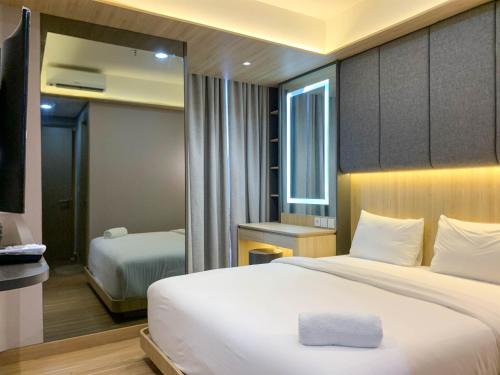 Pantai Indah Kapuk Apartment | Cozy 1BR Gold Coast Apartment with Pool & Family-Friendly Fun