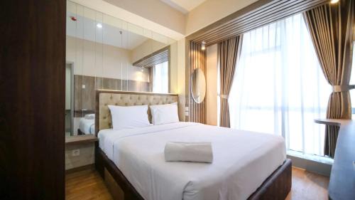 Suko Manunggal Apartment | Cozy 1BR Stay at Grand Sungkono Lagoon Apartment