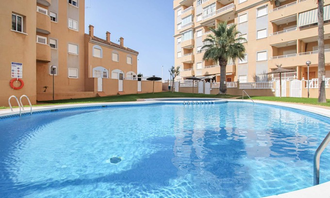 Els Arenals del Sol Apartment | Elegant Apartment with Pool, Steps from Arenales del Sol Beach