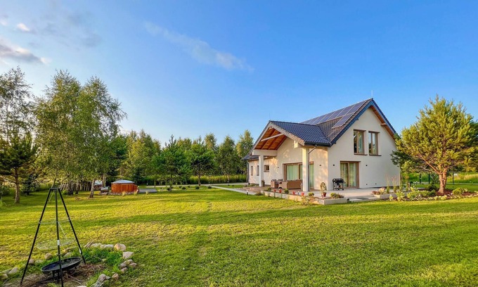 Olsztynek House | Discover Comfort at Mielno Lake: Modern Cottage Retreat