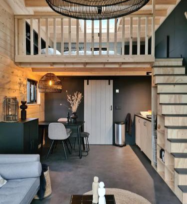 Hulshorst House | Cozy Tiny House by the Water in Nature's Embrace